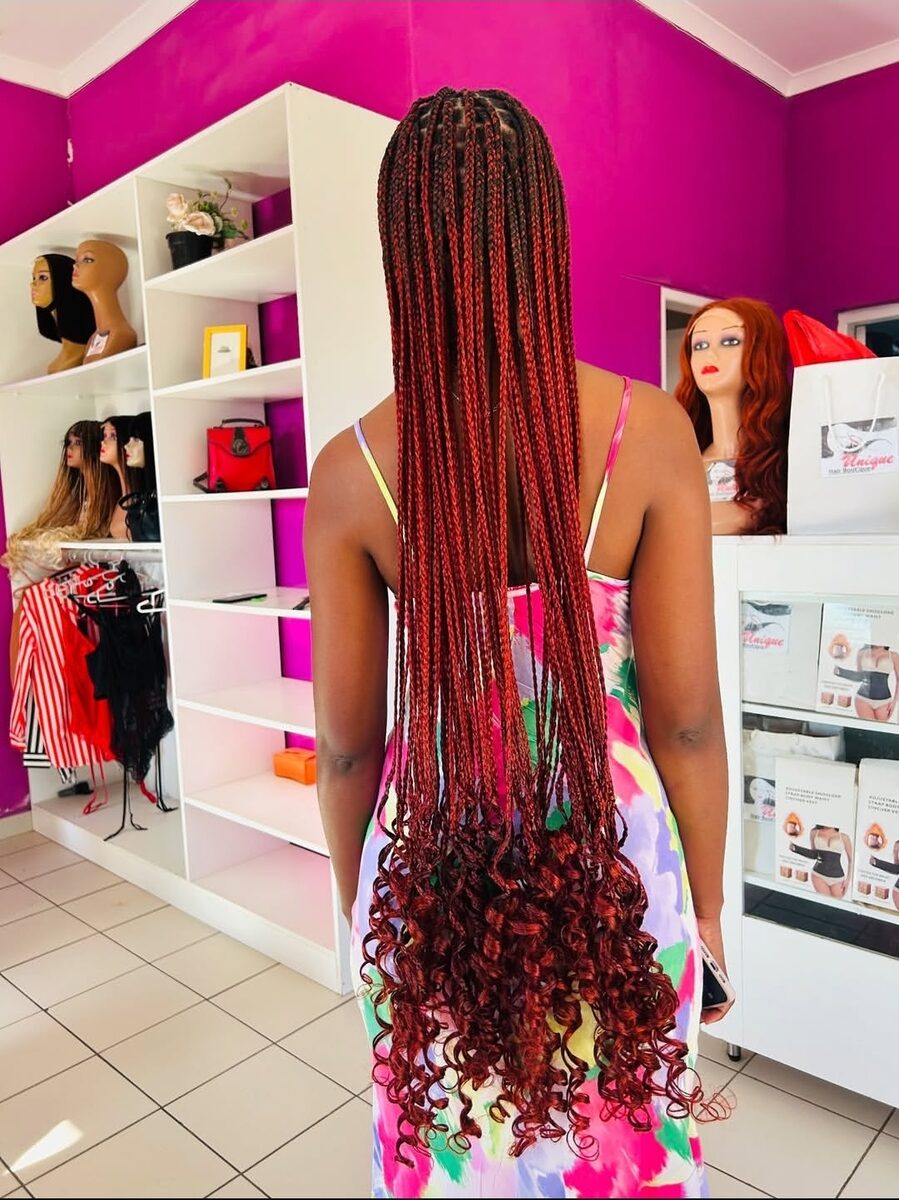 Auburn braids with curly ends