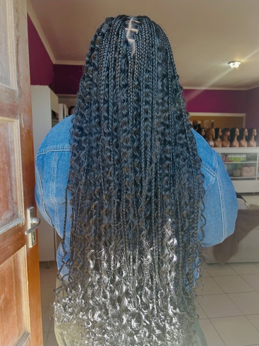 Long black and grey braids with curly ends