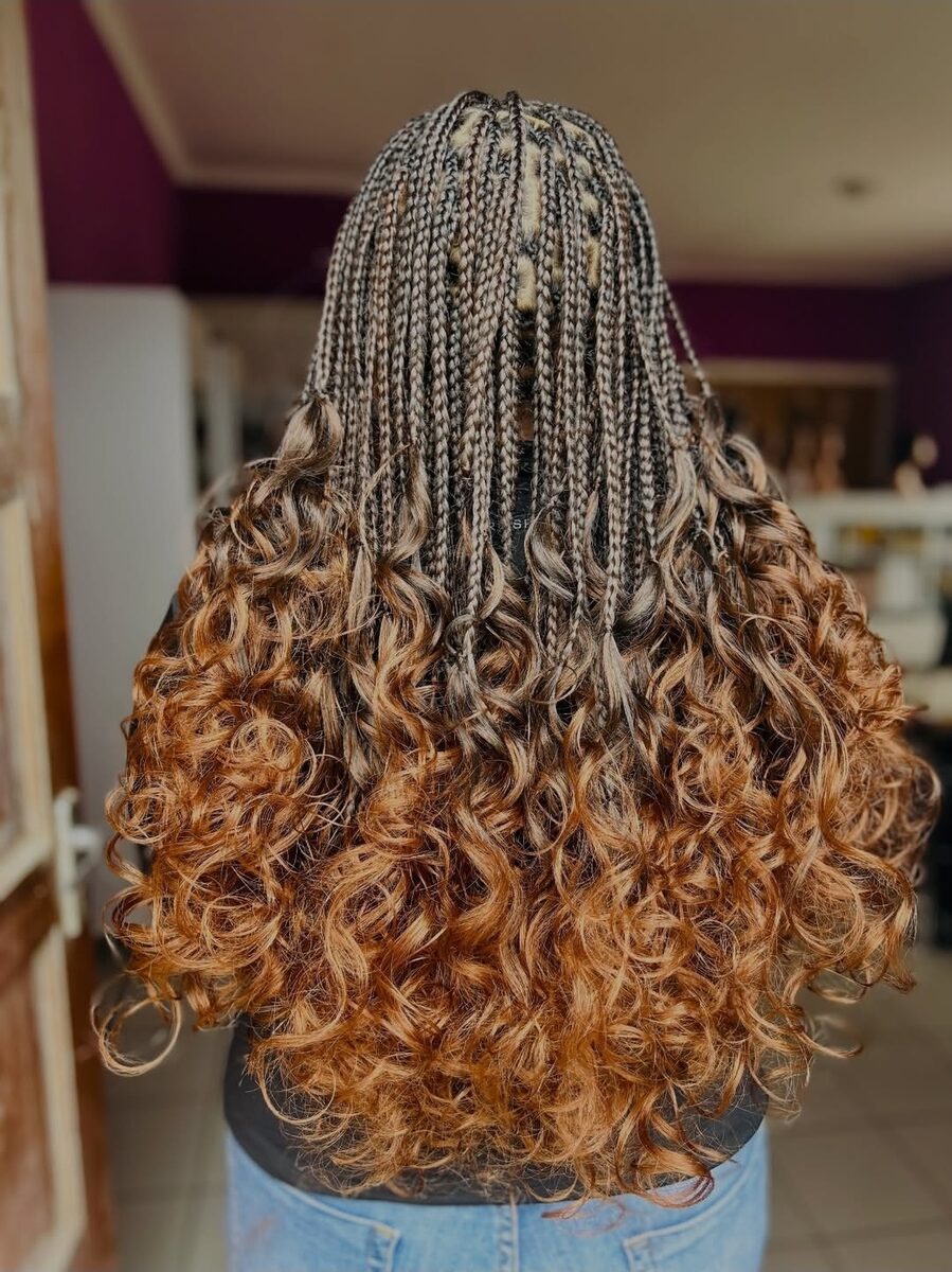 Copper knotless braids with curly ends