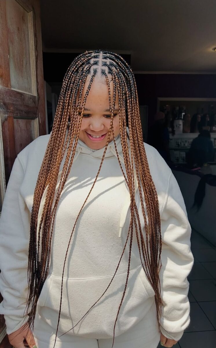 Front view of copper braids framing the face