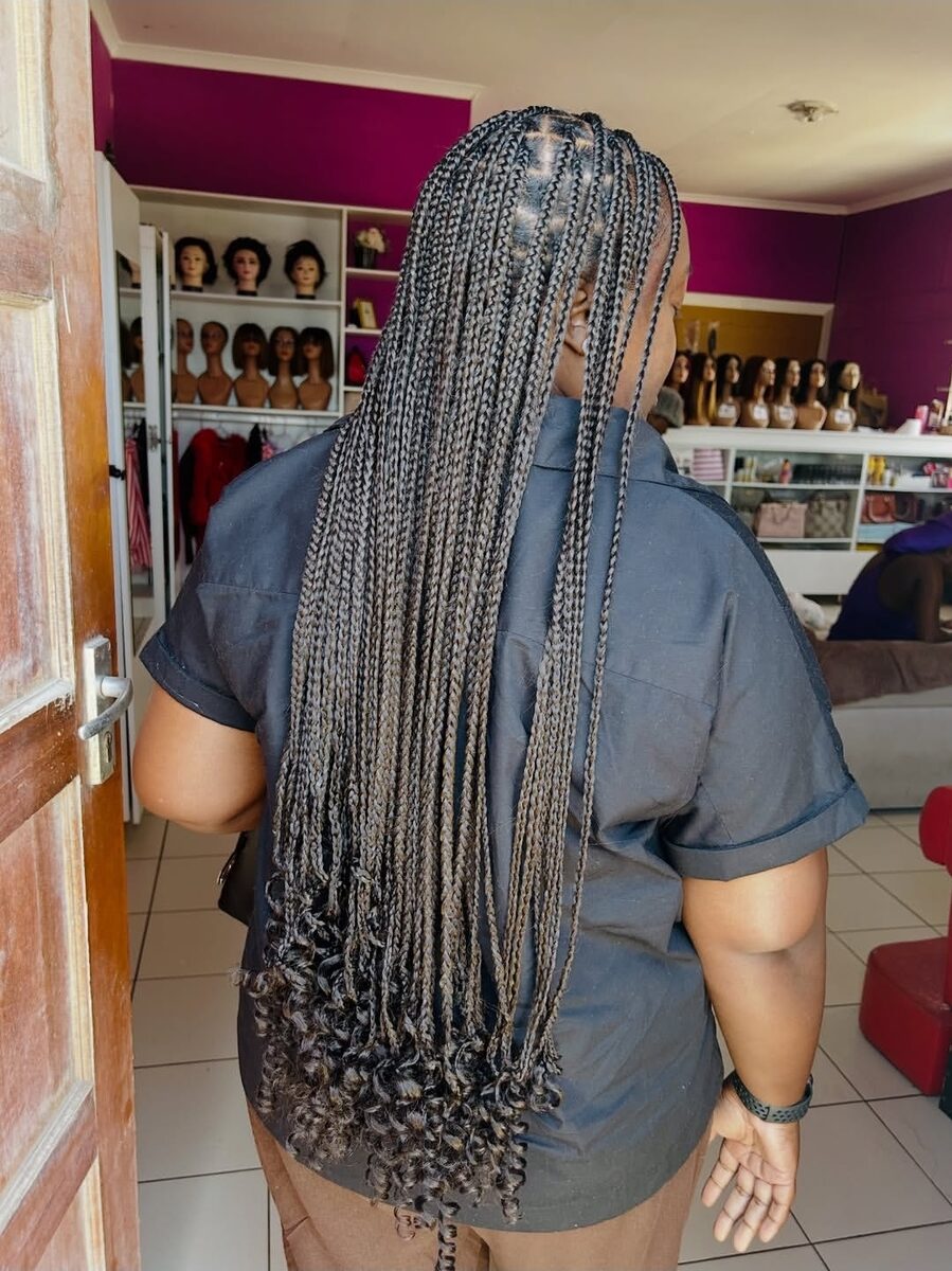 Long grey knotless braids, back view