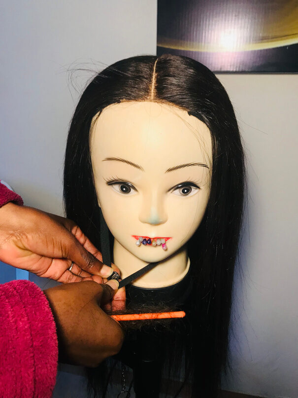 Styling a wig at Total Look By Olivia